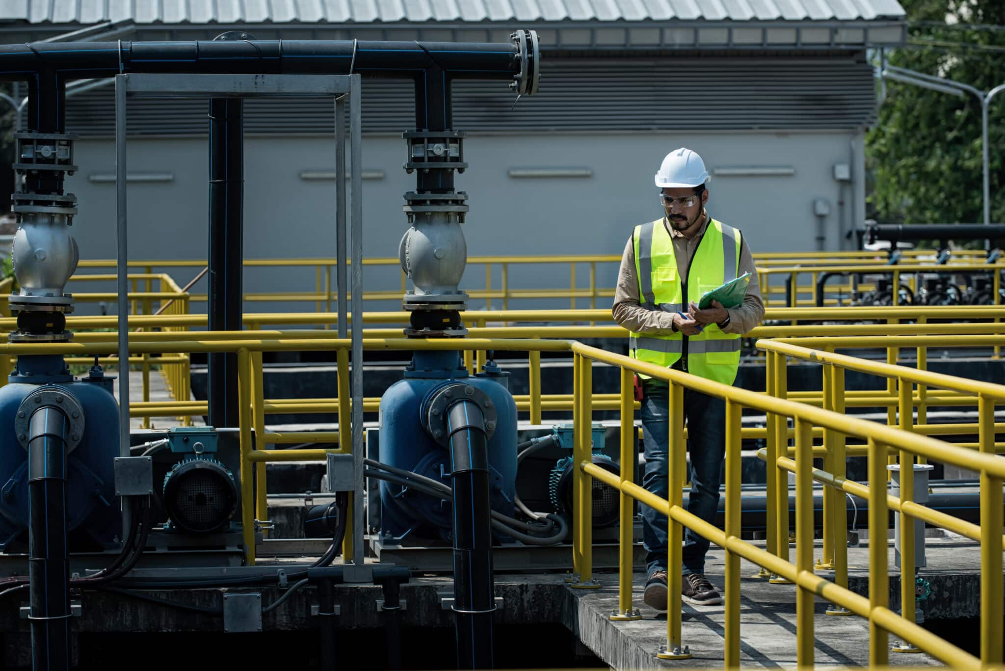 industrial workers at work. Wastewater treatment concept. Service engineer on  waste water Treatment plant.